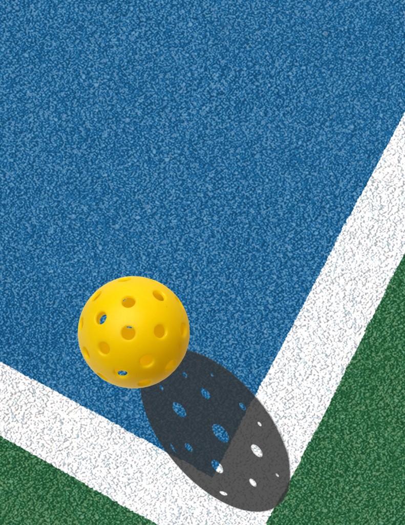 Balle de pickleball au-dessus d'un court indoor