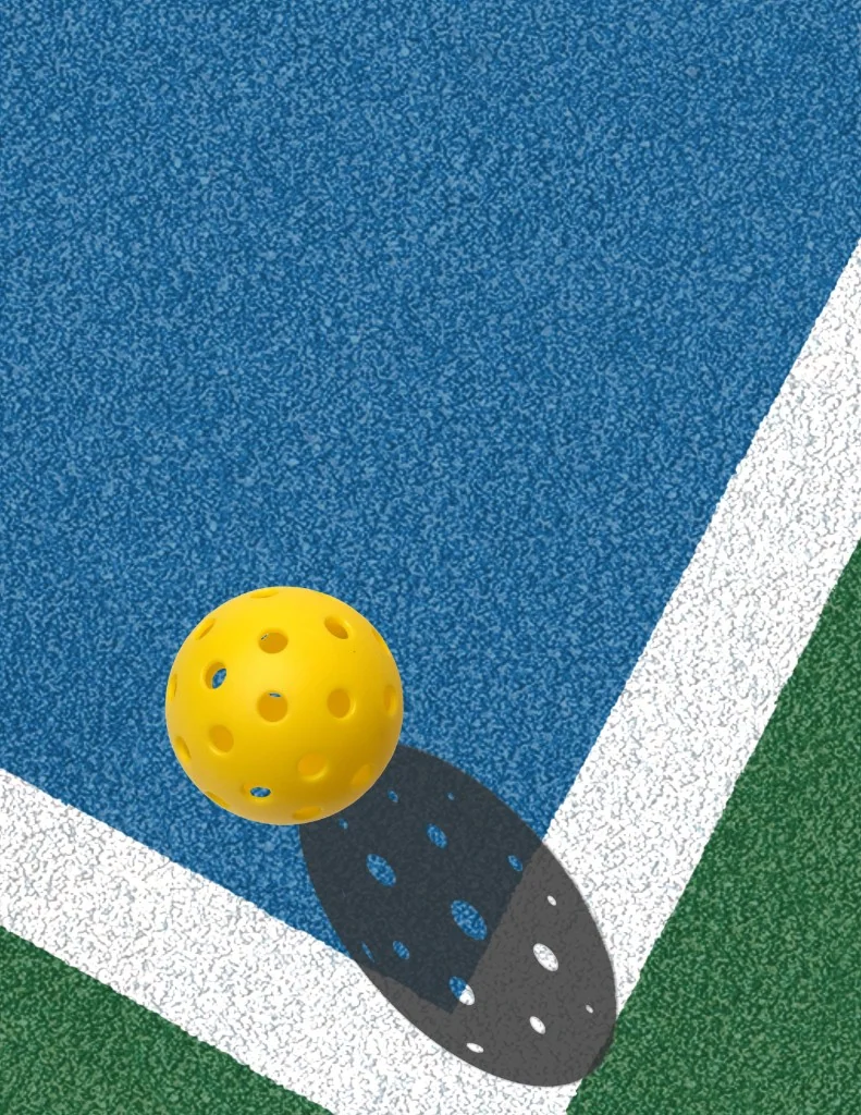 Balle de pickleball au-dessus d'un court indoor